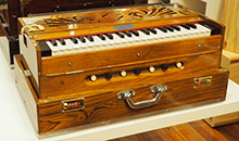 Pakrashi  portable (collapsible) harmonium (natural timber – gloss finish), 3.5 octave, double reeds, comes with wooden cover and carry bag.